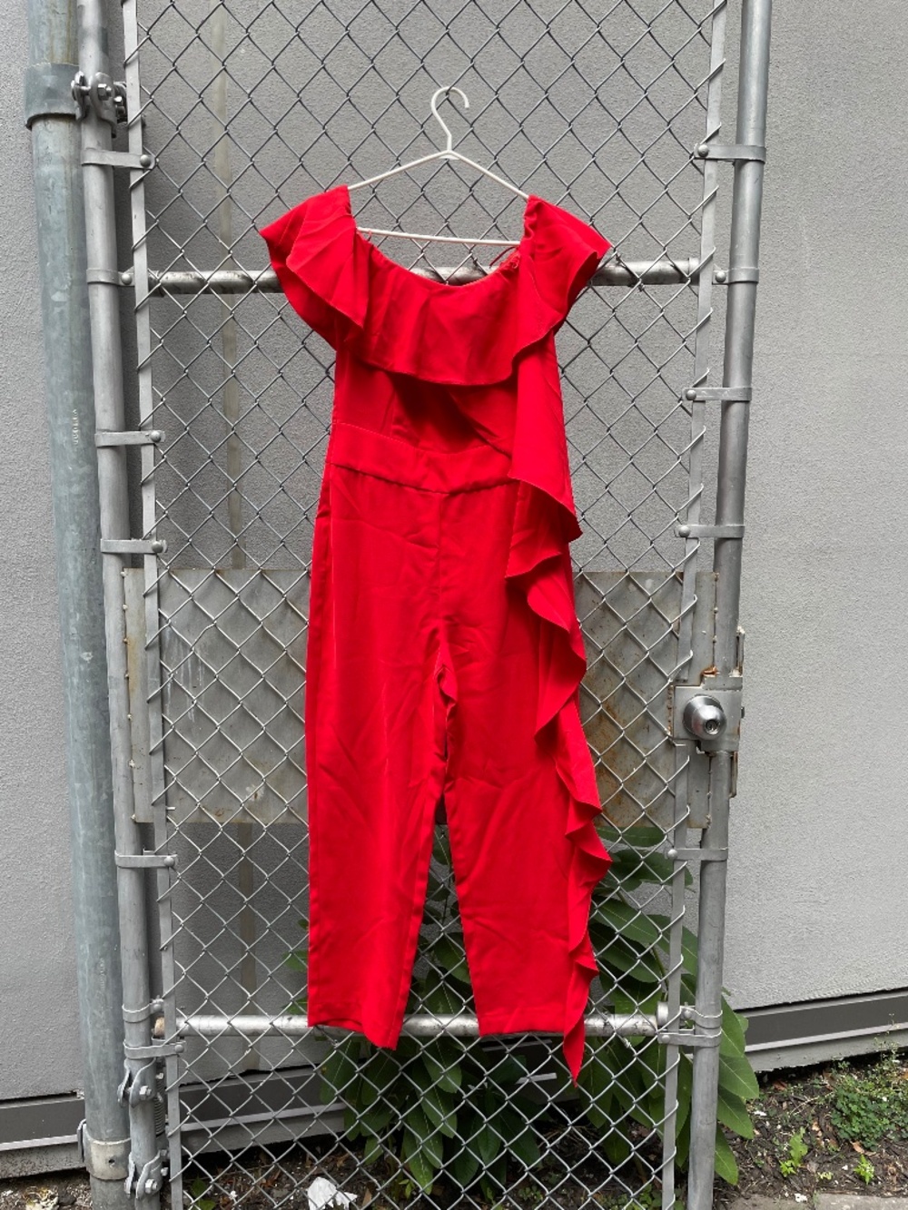 Off-the-shoulder orange ruffle jumpsuit